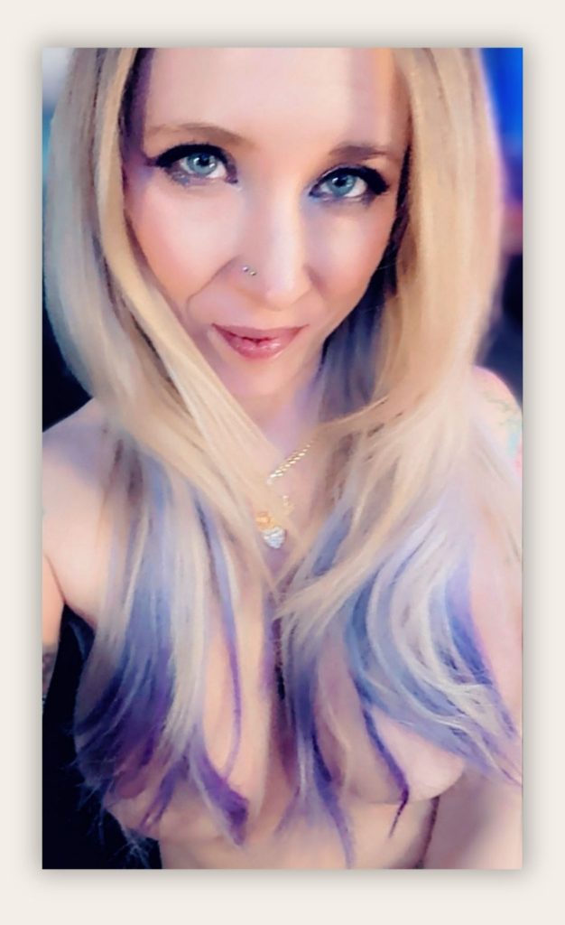 Pretty Blonde woman with blue eyes and blonde hair looking directly at the camera, soft intimate portrait representing emotional imprint and lasting connection